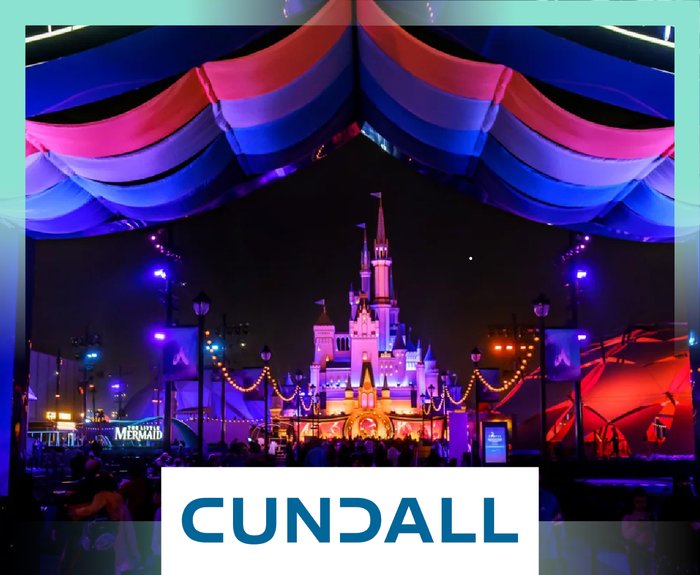 Illuminated Disney-style castle with colourful drapes and CUNDALL Logo overlay