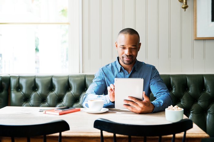 Man at table with tablet GI 691573493 2017