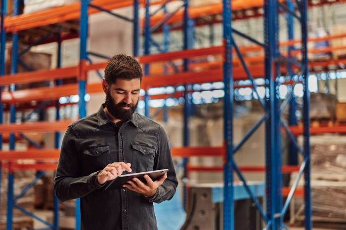 Male worker in industrial warehouse